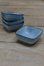 Nordic sea square bowls sat on top of each other 