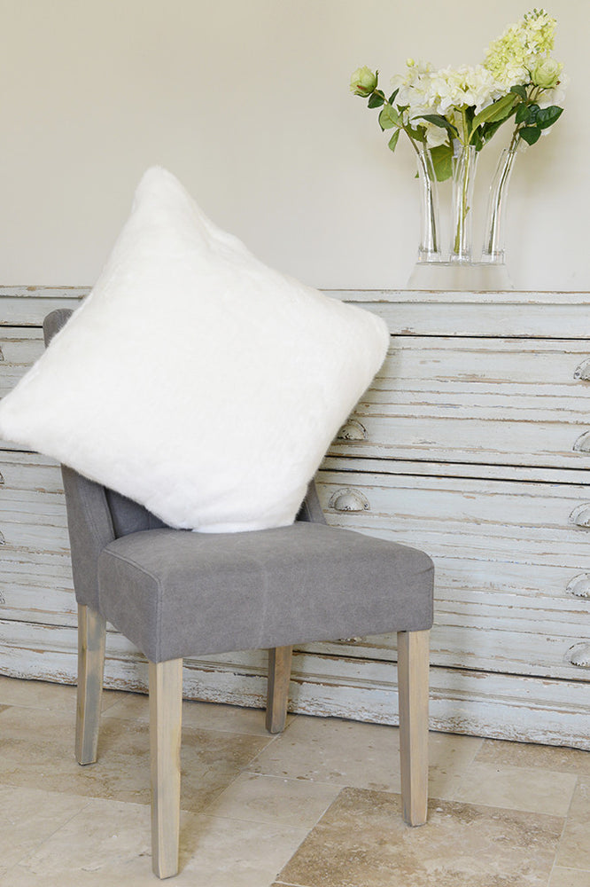 Polar white cushion on grey dining chair