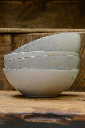 A stack of Nordic Sand cereal bowl, by Broste at Cotswold Grey.