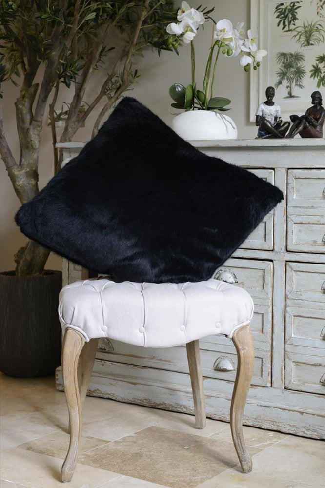
                
                    Load image into Gallery viewer, Cotswold Grey Faux Fur Black Bear Soft Cushion Pictured on Chair 
                
            